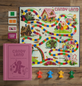 Load image into Gallery viewer, The overhead layout of the Candy Land board game with game pieces and board game box.