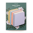 Load image into Gallery viewer, Inklings Sticky Notes shaped like a book stack, set on a backer card with floral design on a green background