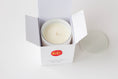 Load image into Gallery viewer, Close up on white candle vessel with a red and yellow wax seal, which features "KC" to represent the KC Chiefs
