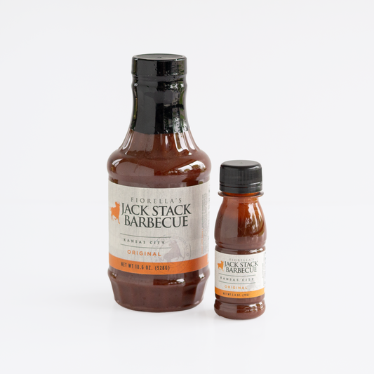Two bottles of Fiorella's Jack Stack Barbecue sauce, one large 18.6 fl oz bottle and one smaller 2.8oz.