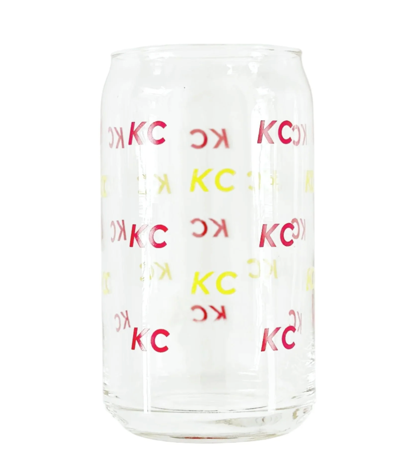 A clear glass can-shaped tumbler with repeating red and yellow 'KC' lettering, shown on a plain white background.