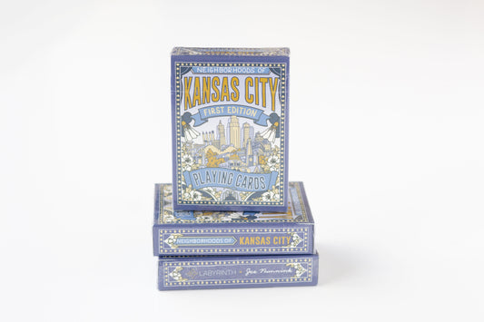 Three decks of Kansas City Blue Edition playing cards stacked on a white background, showing the illustrated blue and gold card box design.