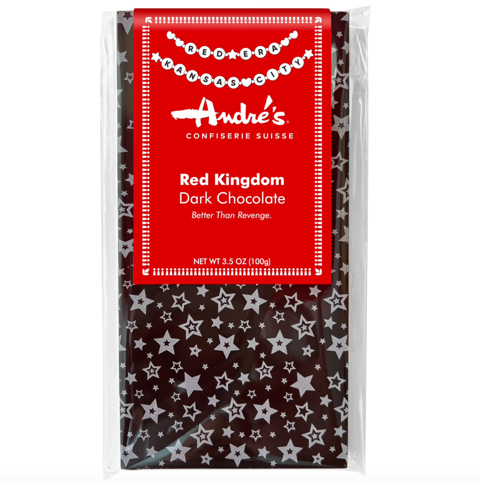 A packaged bar of Andre's Red Kingdom Dark Chocolate in a clear plastic bag with a bright red label and a dark chocolate base patterned with white stars.